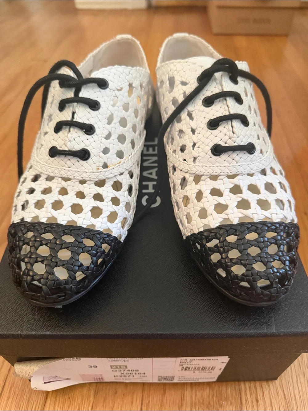 CHANEL White Woven Lace-Up Flats with Black Cap Toe